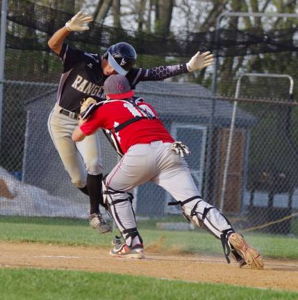 A Wallkill Valley runner is tagged out by the High Point catcher late in the game.