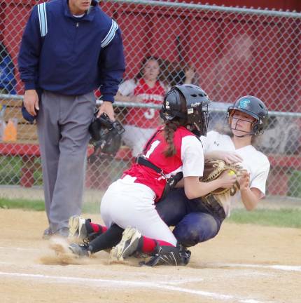 High Point catcher Kate Kiefer tags out sliding Vernon runner Natalie Alheidt at home plate in the third inning.