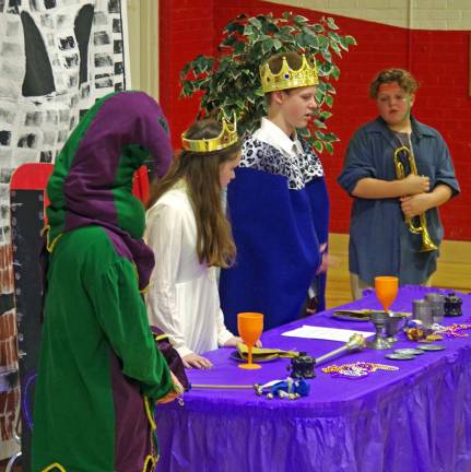 Hamburg School Holds Third Renaissance Faire Her Majesty Queen Aimee and His Highness King Luke are shown explaining the scenario to fourth grade students.