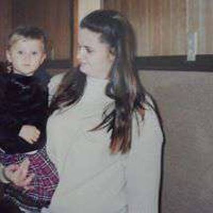 Brandi Kerr of Polk, Pa. holding Erica at a family Christmas party.