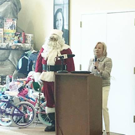 Season of Hope Chosen Freeholders Member George Graham (aka Santa) and Project Self-Sufficiency's Executive Director, Deborah Berry-Toon, at a Season of Hope Toy Drive kick off.