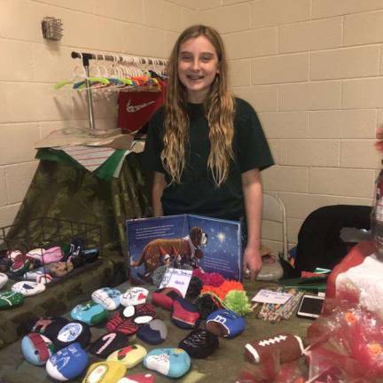 Quinn Walters, of Hardyston, helps her Grandma sell her Baskets for All Occasions