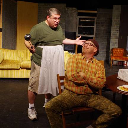 Playhouse prepares for ‘The Odd Couple’ Wearing an apron, Thom Penny of Newton portrays the part of Felix Ungar while Vernon resident Tim Mullally plays the part of Oscar Madison during a rehearsal of "The Odd Couple".