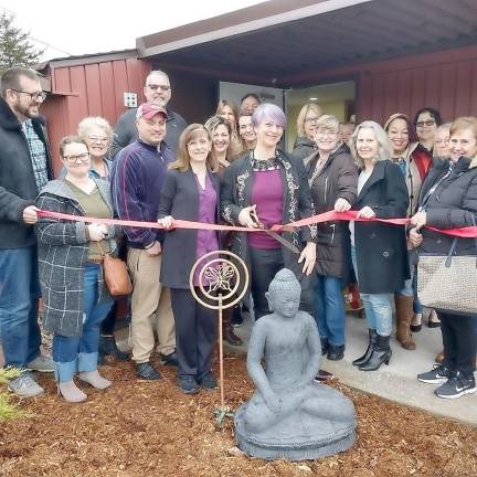 Garden of Life officially opens new location Photographed in center is Garden of Life Massage owner & Licensed Massage Therapist, Dawn Gomez cutting the grand opening ribbon surrounded by staff, family, & friends of Garden of Life.