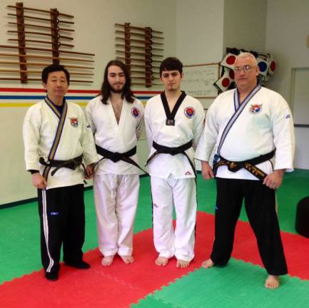 From left, Grandmaster Ik Hwan Kim is show with A. J. Appaluccio, John Fernandes, and Master Phil Coleman.
