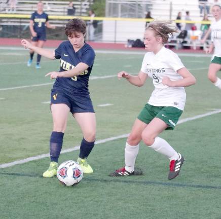 Vernon's Lara O'Toole and Sussex Tech's Catrina Pascale battle for control of the ball