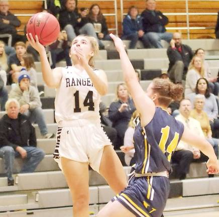 Wallkill Valley's Samantha Opilla leaps skyward with the ball during a shot attempt while covered by Vernon's Olivia Meneses. Opilla scored 14 points.