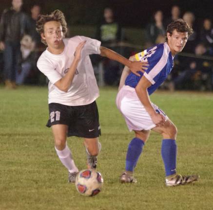 Wallkill Valley's A.J. Rosario moves behind Kittatinny's Michael Callahan in pursuit of the ball.