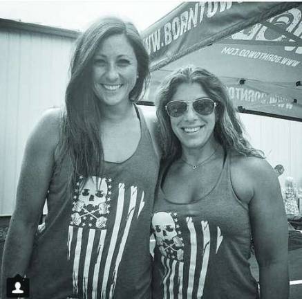 Sparta native launches work out clothing line Owner of Born to WOD Michele Moore ,of Sparta, (right) and Brittany Bogle.