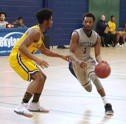 Sussex County's Samir Wheeler dribbles the ball as Cumberland County's Phil Cisrow defends. Wheeler scored 15 points.