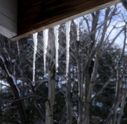 Photo by Gale Miko Icicles hang from a roof like fingers after the recent winter storm in Wantage.