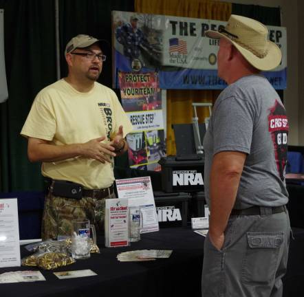 Certified firearms instructor John Liguori of Newton&#xfe;&#xc4;&#xf4;s Stir and Shoot Firearms Training Academy was on hand to tell visitors about their upcoming Third Anniversary free Open House on Nov. 12.