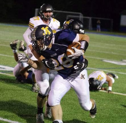 Jefferson running back Ryan Leyden carries the ball in the first half.