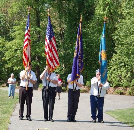 American Legion Post 423's Color Guard at the St Thomas the Apostle cemetery during the Mass celebrated for U.S. veterans.