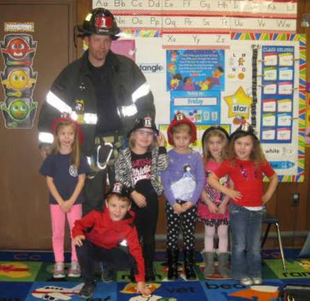 Firefighter father visits learning center