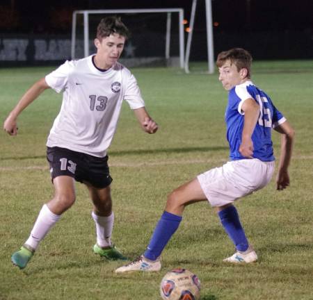 Wallkill Valley's Cole Maurizi and Kittatinny's Nile Mattar are focused on the ball.