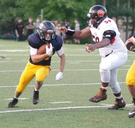 Jefferson falls to Hackettstown in football opener Jefferson running back Matthew Cappello moves the ball through an opening in the first half.
