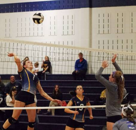 Jefferson's Schyler White leaps towards the ball. White contributed eight kills, one assist, two blocks and six digs.
