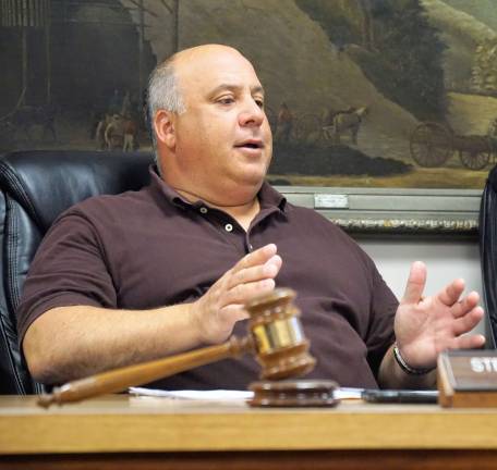 Mayor Steve Ciasullo discusses tax lien properties with resident Eric Schmidl.