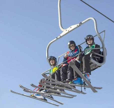 Athletes ride the chairflit to the top of the mountain.