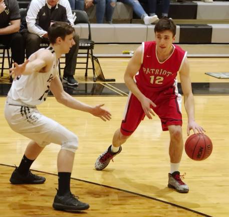 Lenape Valley's Luke Chozick dribbles the ball while covered by Wallkill Valley's Shane Geene in the first half. Chozick scored 12 points.