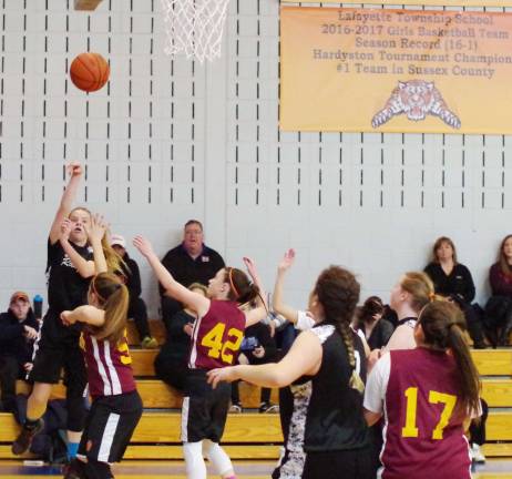 A Wallkill Valley Ranger launches the ball from long distance. The Allamuchy Wolves defeated Wallkill Valley Rangers in 7th grade girls basketball on Saturday, March 18, 2017. The final score was 29-23. The Lafayette Amateur Athletics, Inc. Tournament Invitational elimination round took place at Lafayette Township Elementary School in Lafayette, New Jersey.