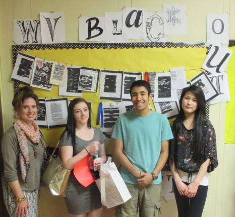 Shown from left, are Assistant Librarian Linda Brigham, with winning studnets Brittany Zeck, Nick Arango and Kelly Ho.