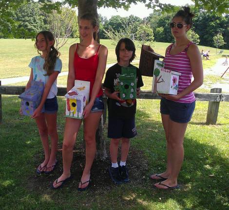 4-H club members who attended the birdhouse-hanging event are, from left, Jordan Toll, Kassidy Wagner, Ethan Horn and Viktoria-Leigh Wagner.