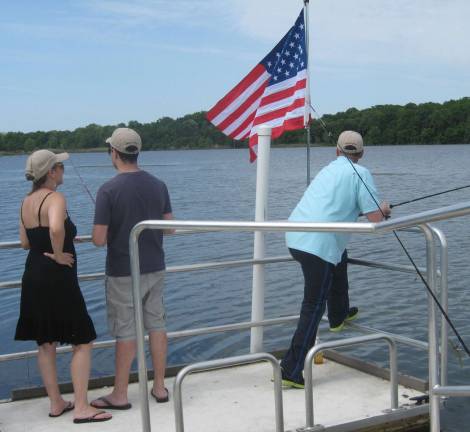 Veterans fish at the lake at Owen Station.