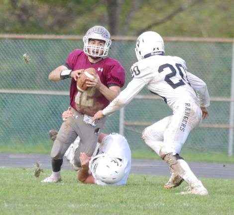 Newton quarterback Michael Freda is in the grasp of a Wallkill Valley defender in the second half. Freda threw the ball for a total of 60 yards. Freda also rushed for 38 yards.