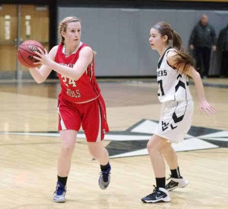 Wallkill Valley falls in girls basketball Morris Hills Lauren Sysyn holds the ball while covered by Wallkill Valley's Ally Lame.