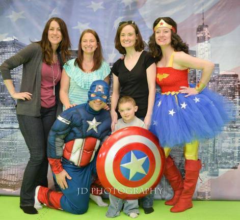 JD Photography A picture from this past weekend's event in Lafayette benefiting a West Milford child. Pictured from left: Caryn Christiano, Betsy Hamilton, Michelle Skolnick, Cheryl Connors, Captain America played by Brian Hamilton (Betsy's husband) and the beneficiary of the event Joey Vaspory. JD Photography also raises funds for children on the autism spectrum.