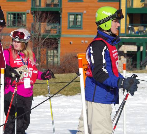 Preparing to board the lift for their second races of the day are Carol Spilotras of Barry Lakes and double gold-medal winner Kyle Dehn of Glenwood.