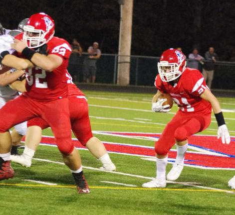 Lenape Valley runs past Wallkill Valley Lenape Valley ball carrier Cole Robertson finds a hole to move through.