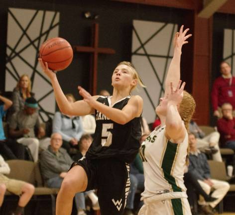 Wallkill Valley's Natalia Mianowski begins to leap skyward with the ball during a shot attempt in the third period. Mianowski scored 2 points, grabbed 2 rebounds and accomplished 5 steals.