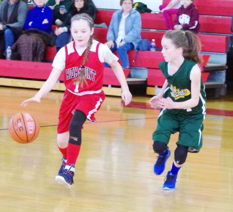 High Point's Lily Mania dribbles the ball while covered by Rockaway's Sydney Mulroony.