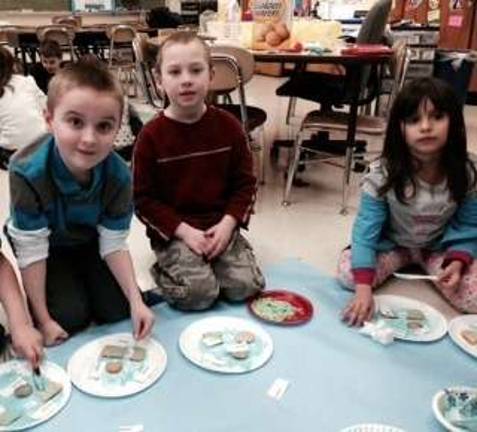 Franklin students create edible landforms Preston Molnar, Noah DeRenzo and Kelsie Jaconetta are shown with their landforms.