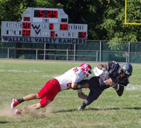 Lenape Valley defensive back Connor Johnson takes down Wallkill Valley receiver Alfred Boye-codjoe. Boye-codjoe had a very productive day running 60 yards after catching the ball for a touchdown and another long gain on the ground for 83 yards resulting in a touchdown.