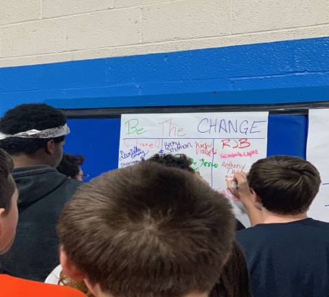 Franklin students sign their names to commit to BE the CHANGE in the world.