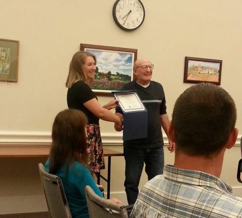 Lafayette residente among state finalists in competition Photo by Lori Comstock Victoria Pizzulo is shown with Lafayette Mayor John Hughes after being presented with a certificate for becoming a state finalist in an essay competition.