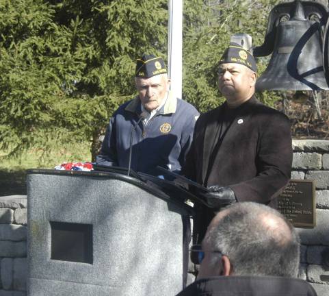 Commander Gene Rounds of American Legion Post 245 and Commander Mehandra Lachicharran of Post 423 read the names of members who have served in the American Legion for 50 years or more.