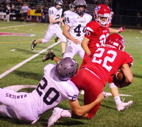 Lenape Valley runs past Wallkill Valley Wallkill Valley defender Shane Simon brings down Lenape Valley ball carrier Troy DuPont in the first half.