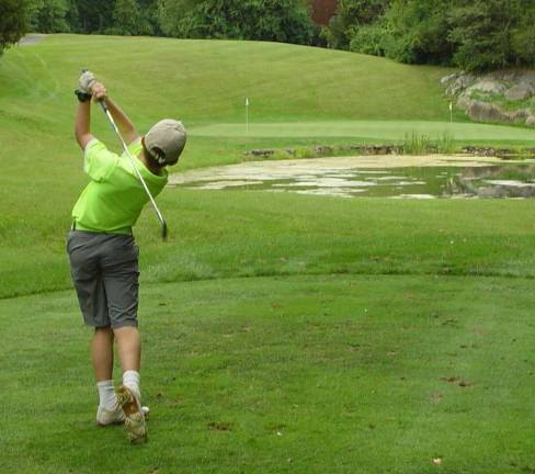 Avery Cohen shows winging form teeing off at the at the par 3 4th hole.