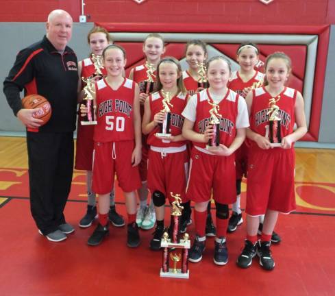 The champion High Point fifth grade travel basketball team with their coach Tom Smith. Players names starting from back row are Michelle Sondej, Brooke Baisley, Lindsey Fehir and Meghin Jennings and front row are Olivia Wagner, Kelsey Birchenough, Lily Mania and Leah English.