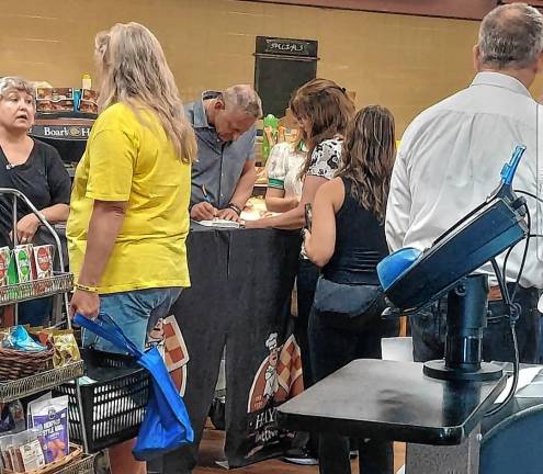 A killing and its aftermath Clark Fredericks signs his book, ‘Scarred: A Memoir of a Childhood Stolen and a Life Redeemed,’ on Wednesday, July 29 in Newton.