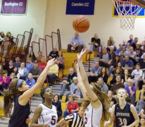 Jefferson's Taylor Langan tosses the ball towards the basket.