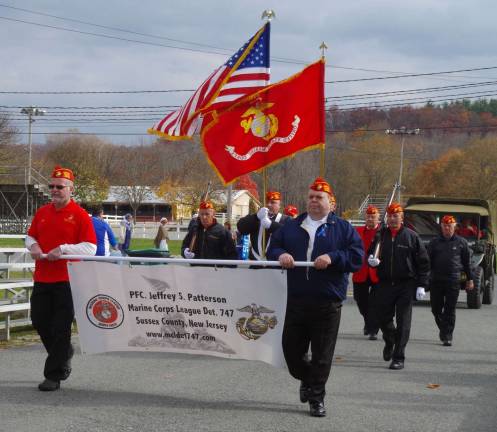 Former Marines march in the parade.