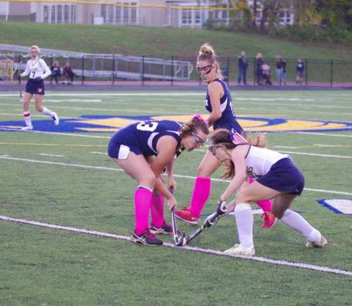 Jefferson tops Pope John in field hockey Scramble for the ball.