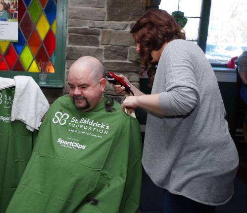 As Master of Ceremonies Jon B tried to get the audience to donate another $75 if Michael Friedman of Hamburg also had his goatee removed by Highland Lakes resident Maureen Casselli of Prohaircutters of Rockaway. At then end of the session, his goatee was gone as well.