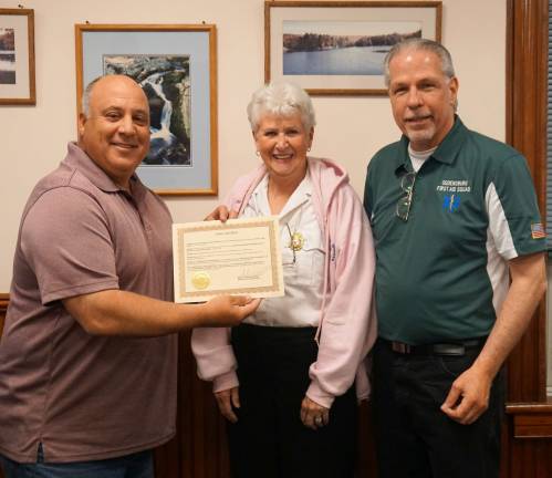 From left, Mayor Steve Ciasullo presents a proclamation to Ogdensburg First Aid Squad representatives Patricia Sabourin and Alan Arduini.
